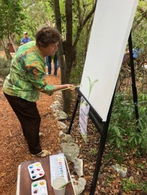 Author Elaine Powers at easel