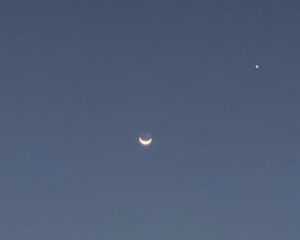 photo of crescent moon and the planet Venus near each other