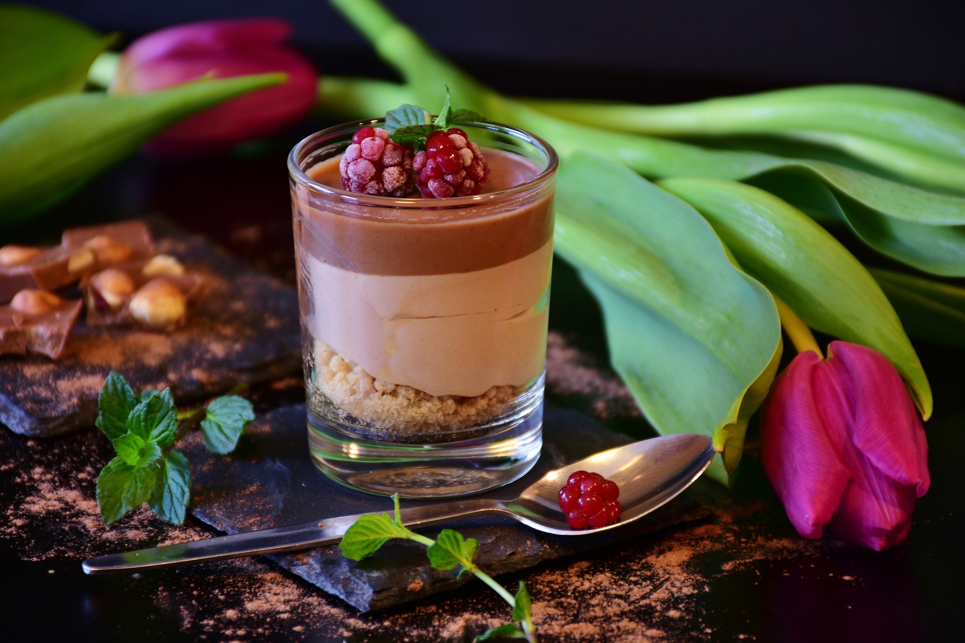 photo of a glass of chocolate mousse on a table
