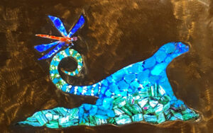 An artwork made up of bright blue natural minerals. 