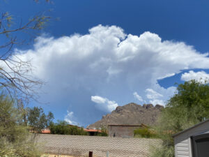 A view from Elaine's backyard, clouds moving over the Catalina mountains.