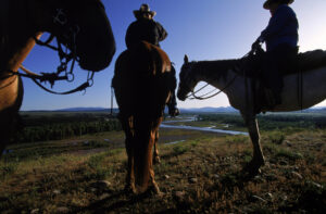 Trail rides out of Lost Creek Ranch utilizes Park land -- this one at sunrise heads towards the Snake River where a view to the north shows the "snaking" bends and twists of the waterway.